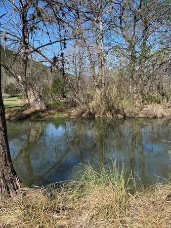 a view of a lake from a yard