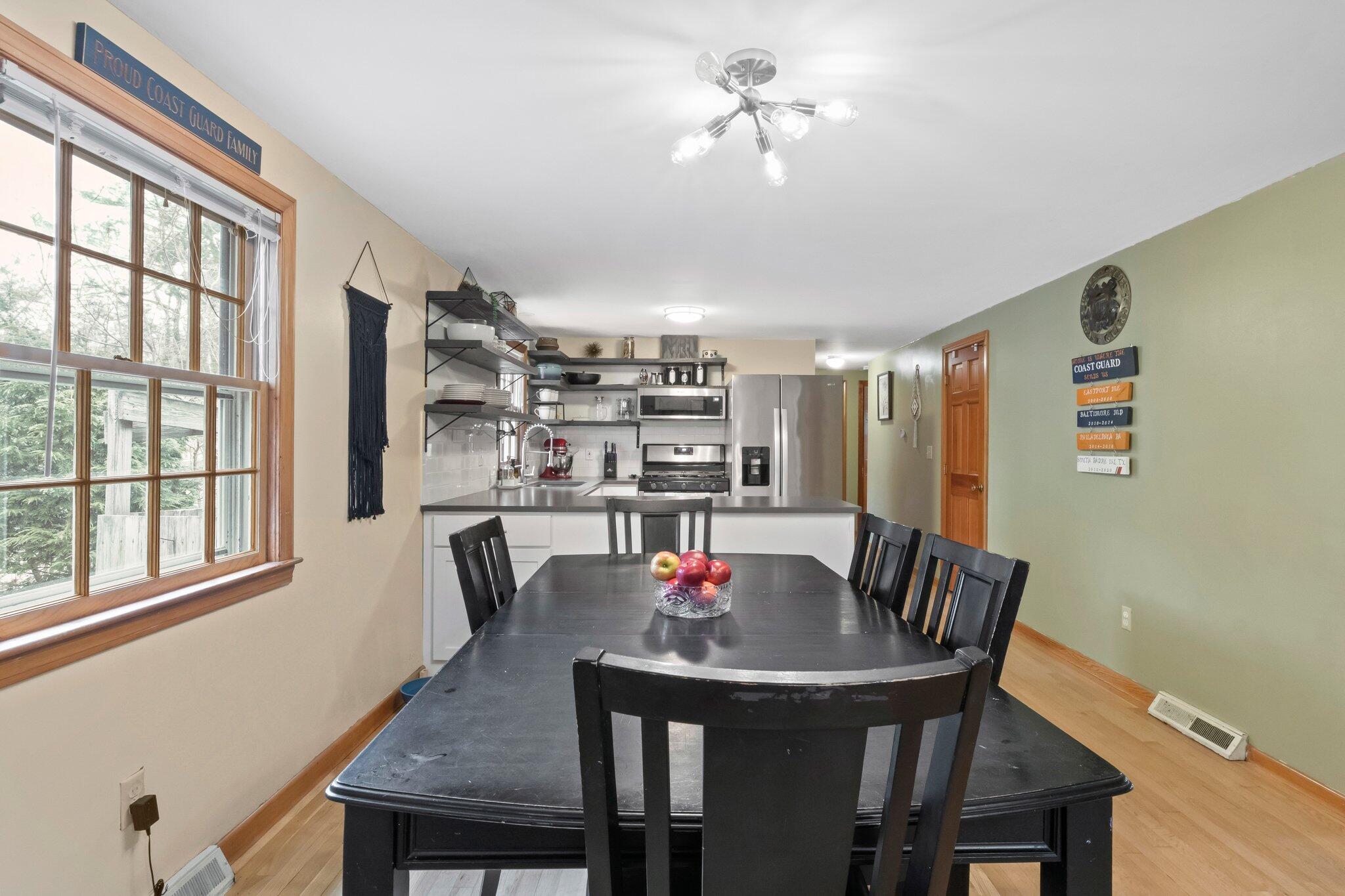 3 Lietrim Circle Centerville, MA 02632 - Photo 11 of 42 a view of a dining room with furniture window and wooden floor