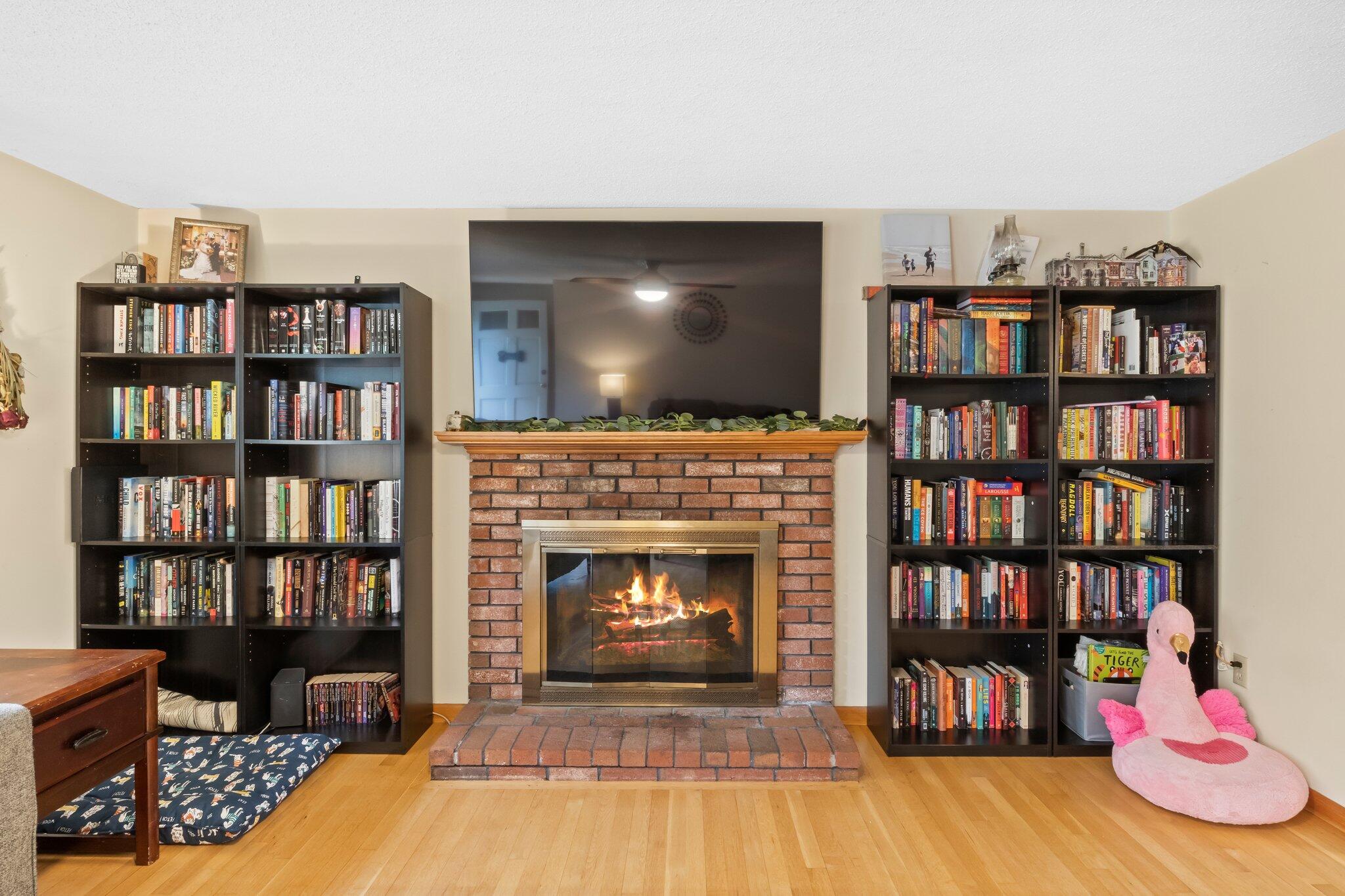3 Lietrim Circle Centerville, MA 02632 - Photo 19 of 42 a living room with bookshelf and a fireplace