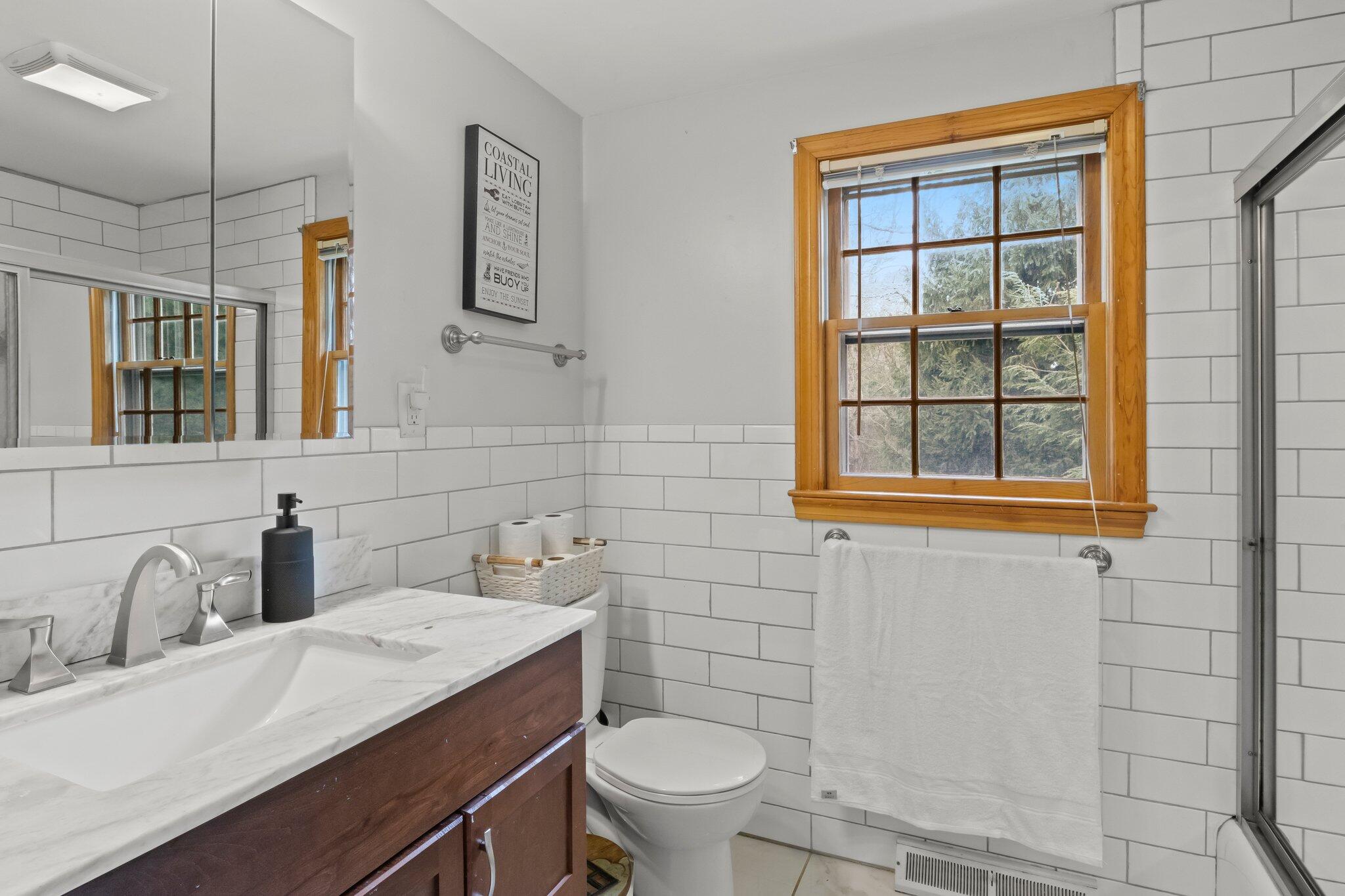 3 Lietrim Circle Centerville, MA 02632 - Photo 22 of 42 a bathroom with a granite countertop toilet sink and mirror