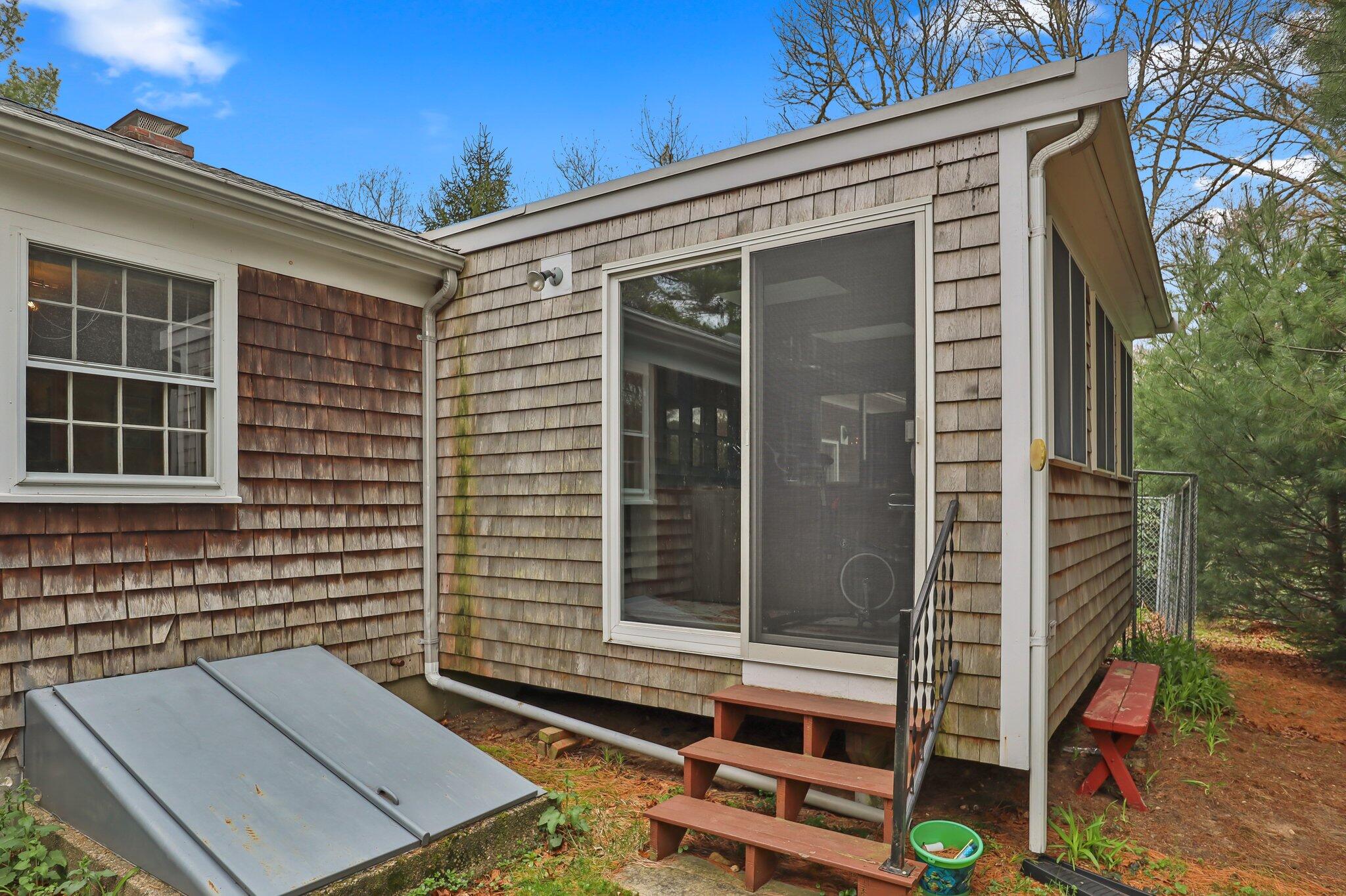 3 Lietrim Circle Centerville, MA 02632 - Photo 35 of 42 a backyard of a house with seating space