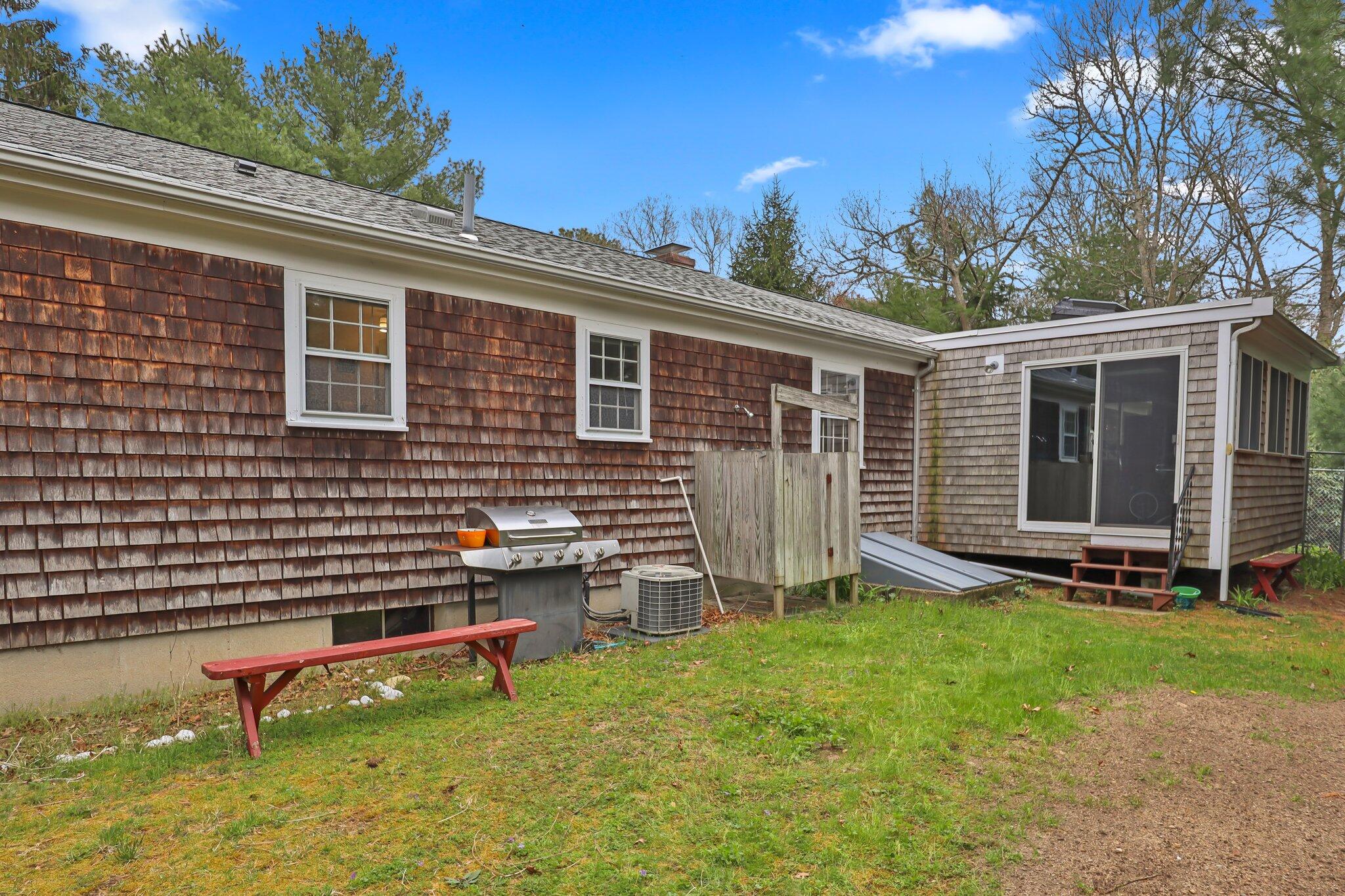3 Lietrim Circle Centerville, MA 02632 - Photo 37 of 42 a backyard of a house with barbeque oven