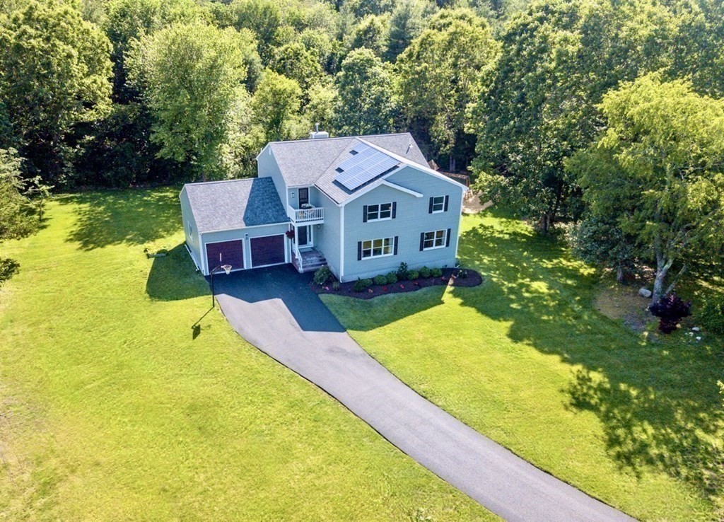 a aerial view of a house with swimming pool