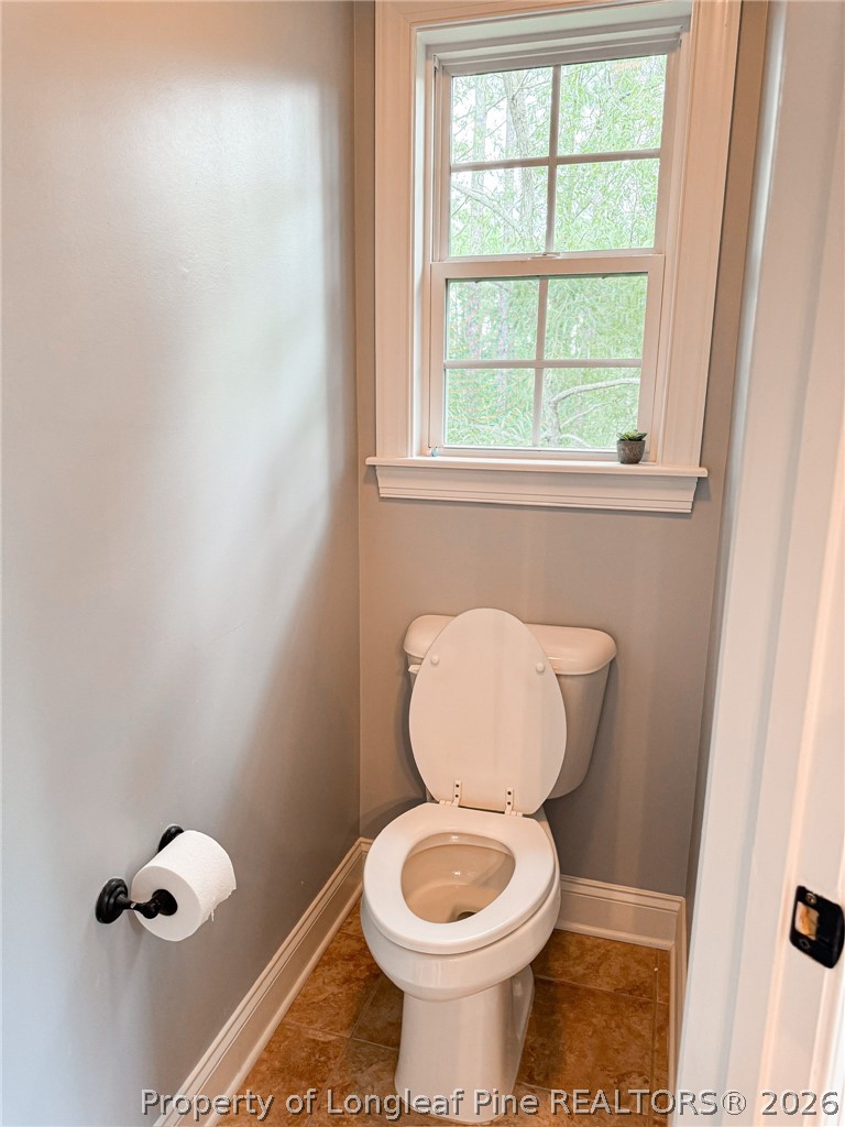 93 Falcon Ridge Drive Spring Lake, NC 28390 - Photo 24 of 50 a bathroom with a toilet sink and mirror