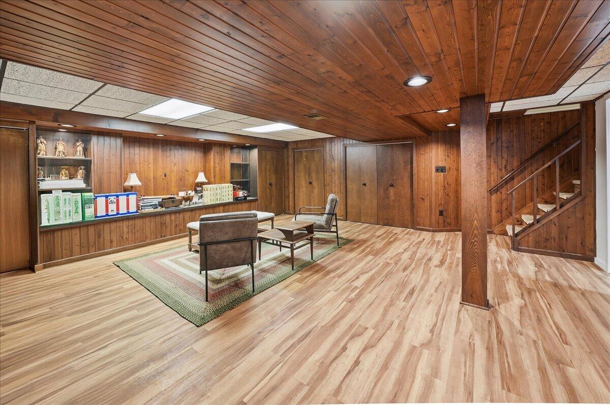 63 Ski Hill Road Portage, IN 46368 - Photo 19 of 28 a view of a patio with table and chairs with wooden floor
