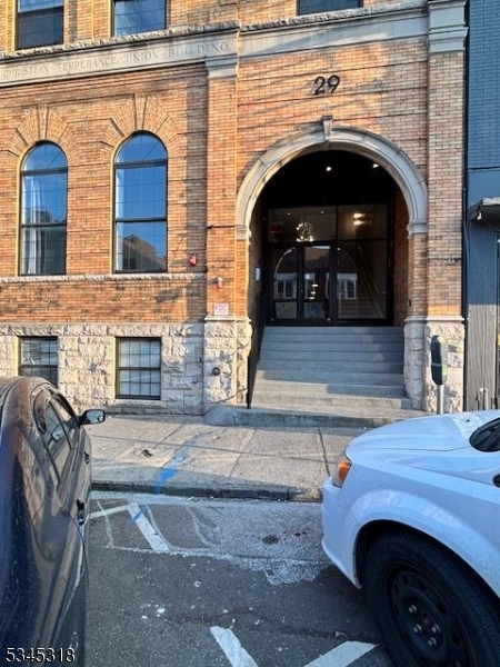 29 Broadway, Unit 2 3 Passaic, NJ 07055 - Photo 8 of 9 a front view of a house with fireplace