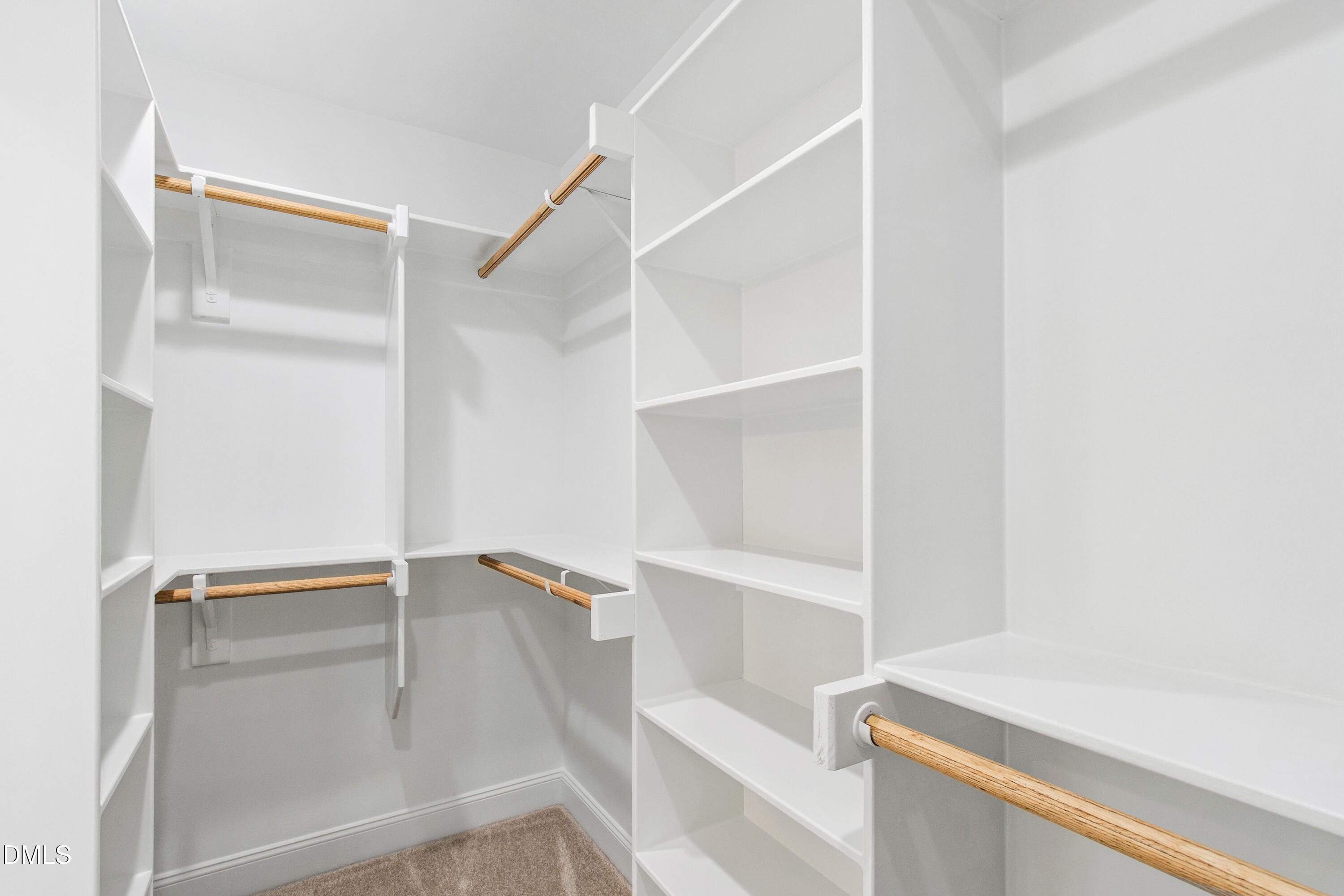 77 Falls Riv Court Broadway, NC 27505 - Photo 23 of 39 a view of walk in closet with empty racks