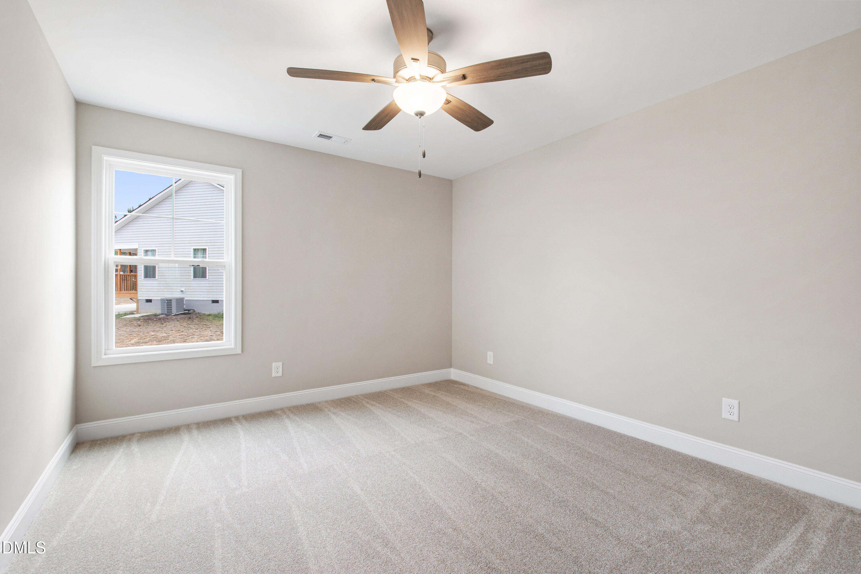 77 Falls Riv Court Broadway, NC 27505 - Photo 24 of 39 an empty room with a window and a ceiling fan