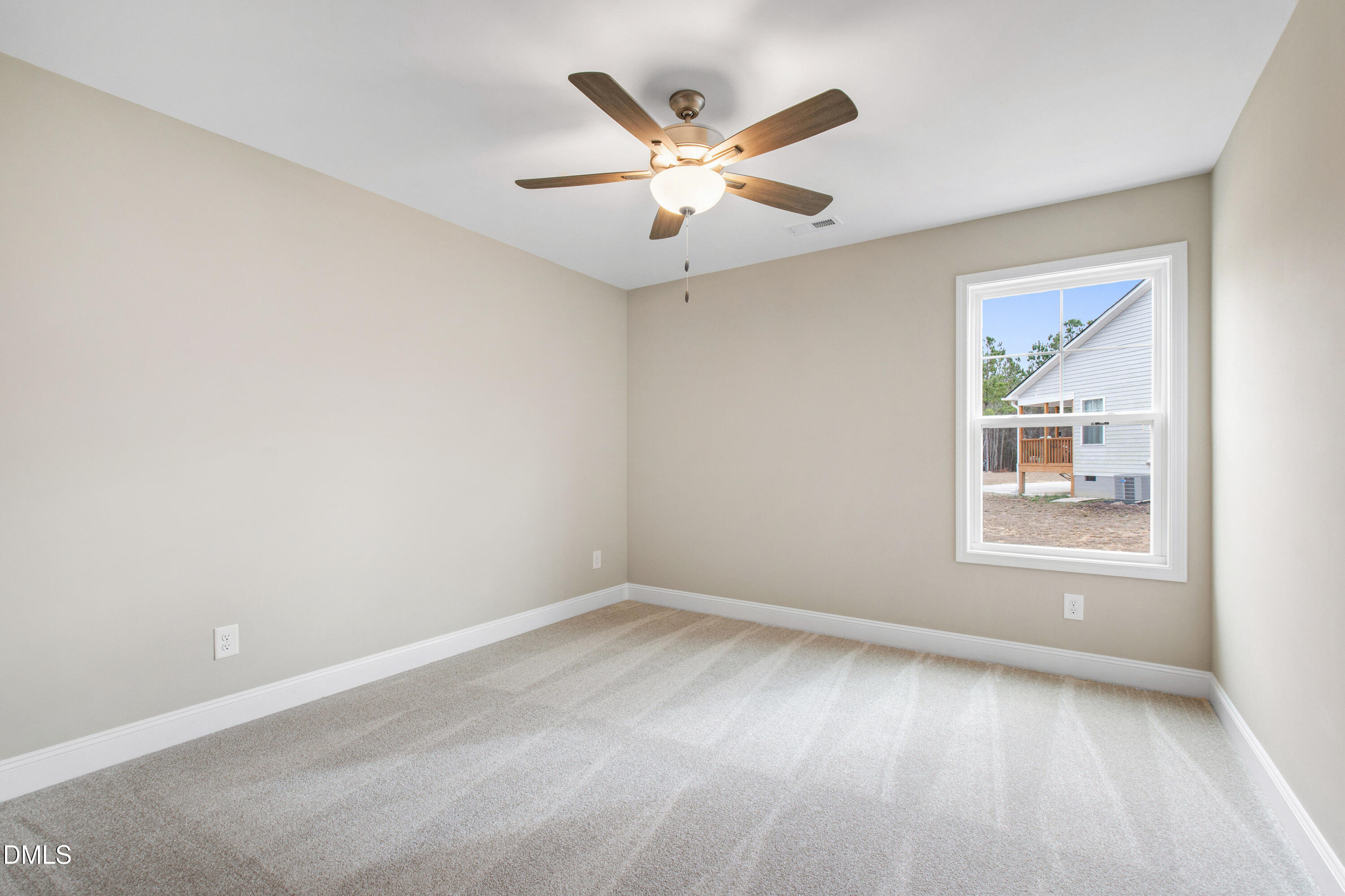 77 Falls Riv Court Broadway, NC 27505 - Photo 27 of 39 an empty room with wooden floor and ceiling fan