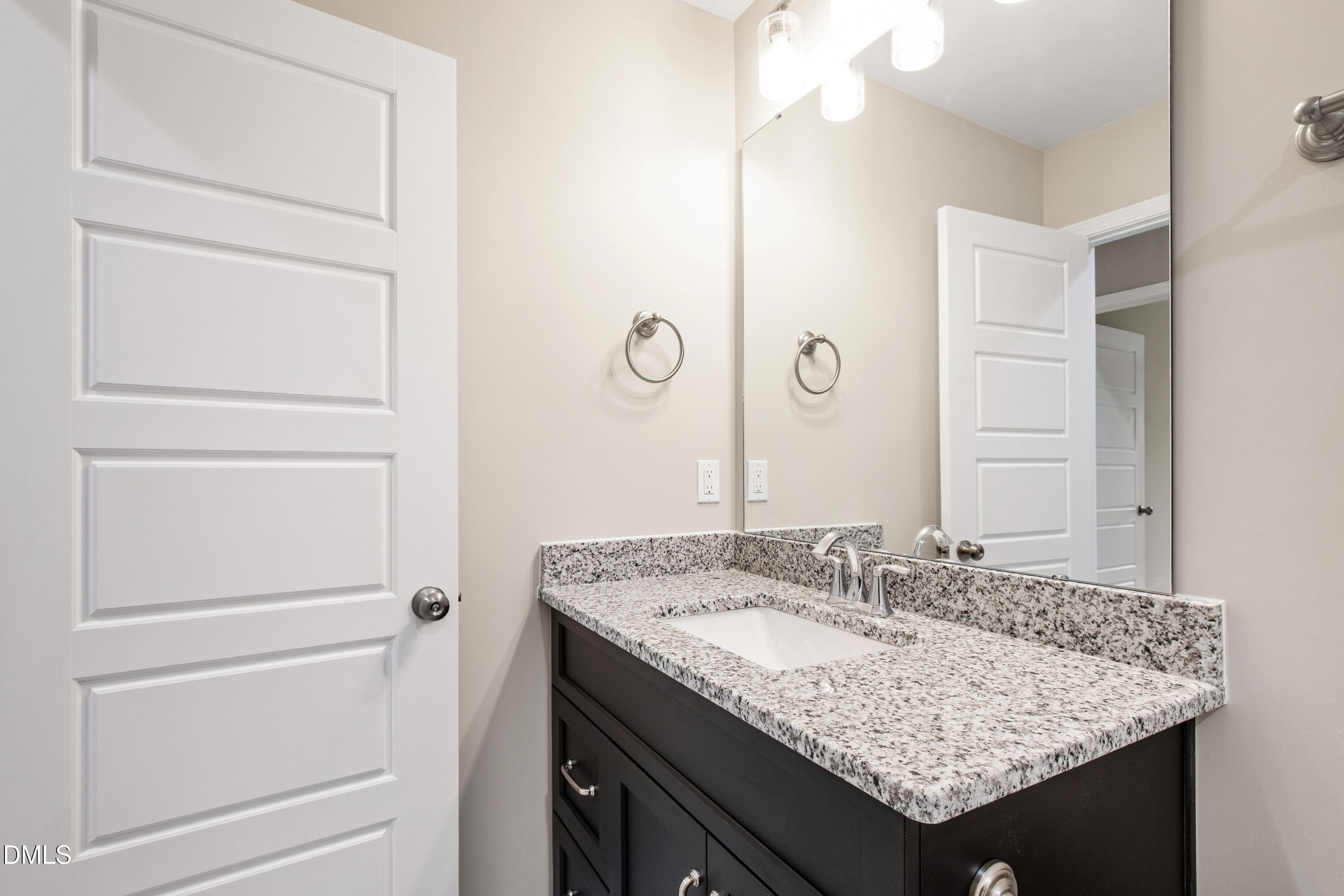 77 Falls Riv Court Broadway, NC 27505 - Photo 29 of 39 a bathroom with a granite countertop sink and a mirror