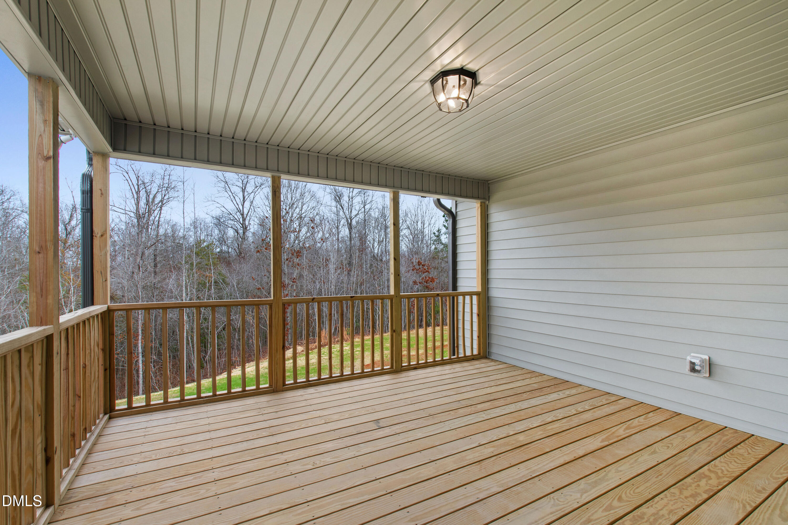 77 Falls Riv Court Broadway, NC 27505 - Photo 32 of 39 a view of a balcony with wooden floor