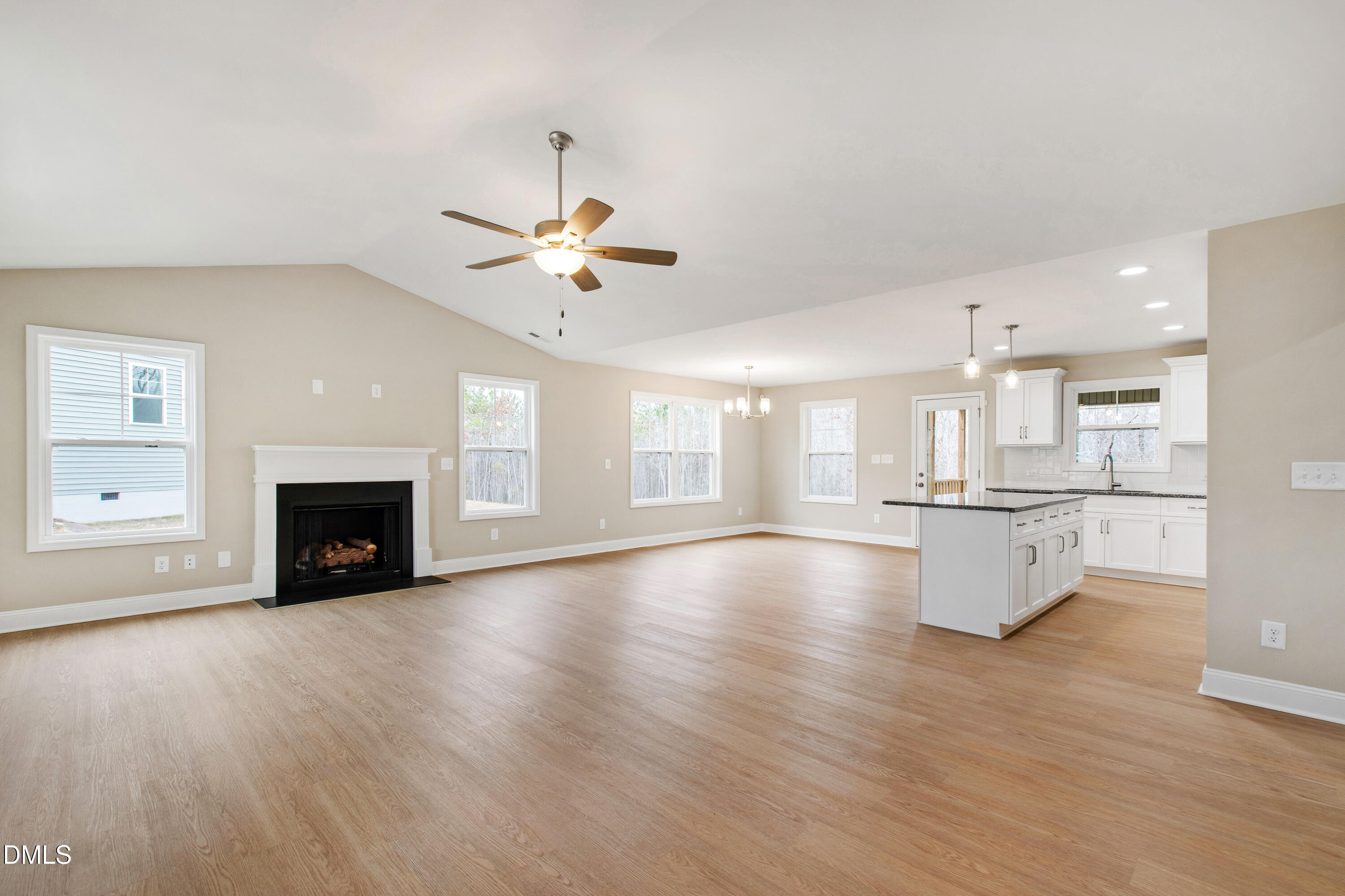 77 Falls Riv Court Broadway, NC 27505 - Photo 4 of 39 a view of an empty room with a fireplace and window