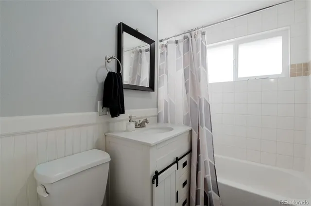 a bathroom with a sink a toilet and a bathtub