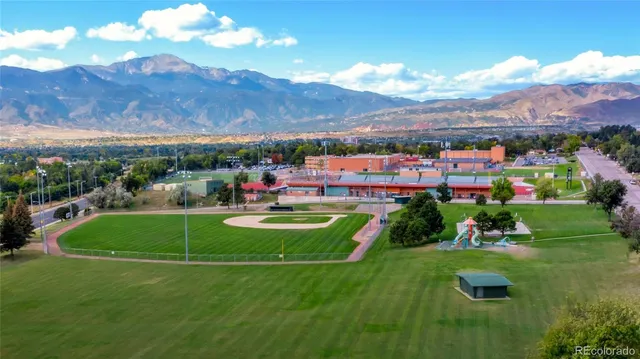 a view of a golf course with a houses