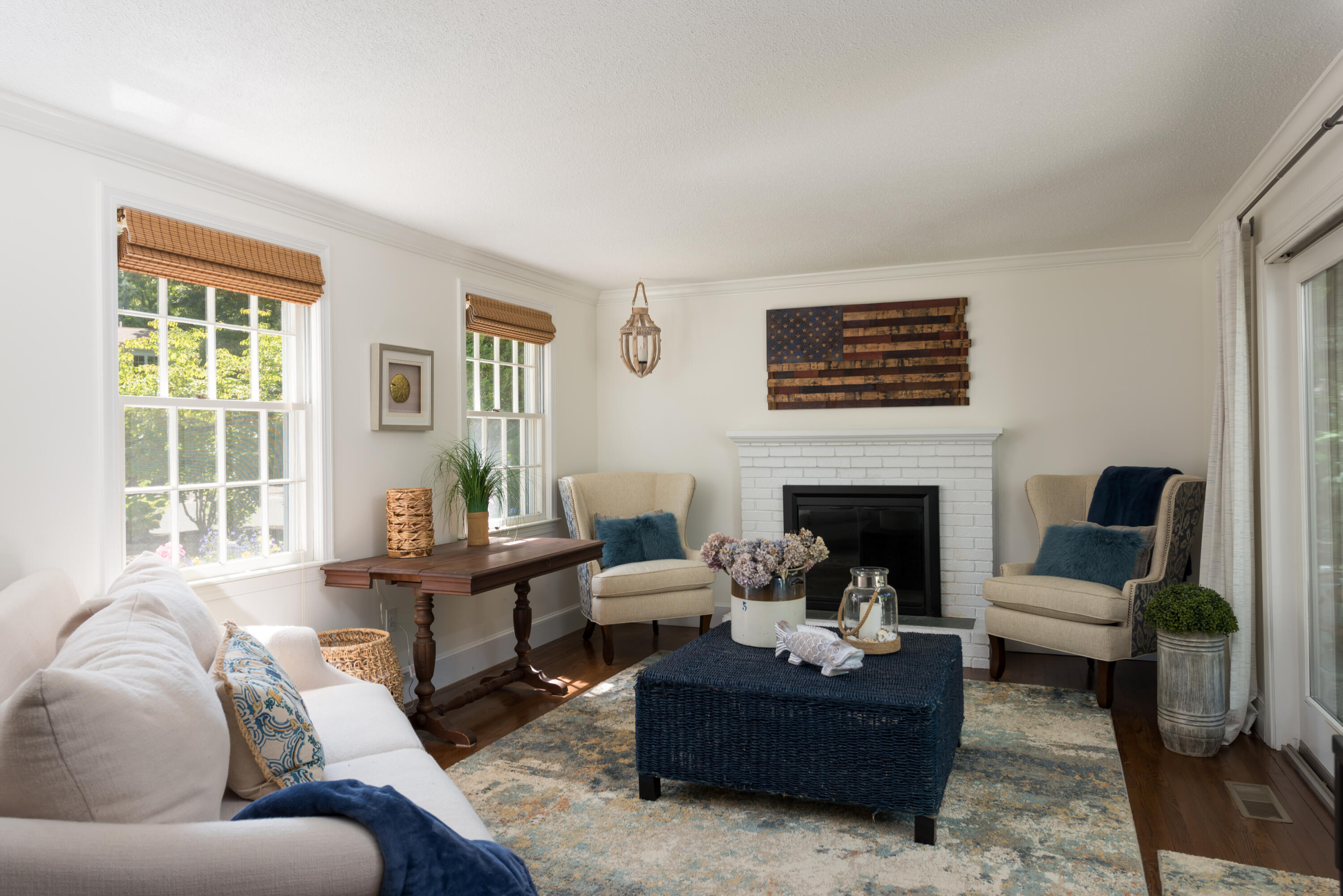 7 Sand Dollar Lane Mashpee, MA 02649 - Photo 11 of 33 a living room with furniture a large window and a fireplace