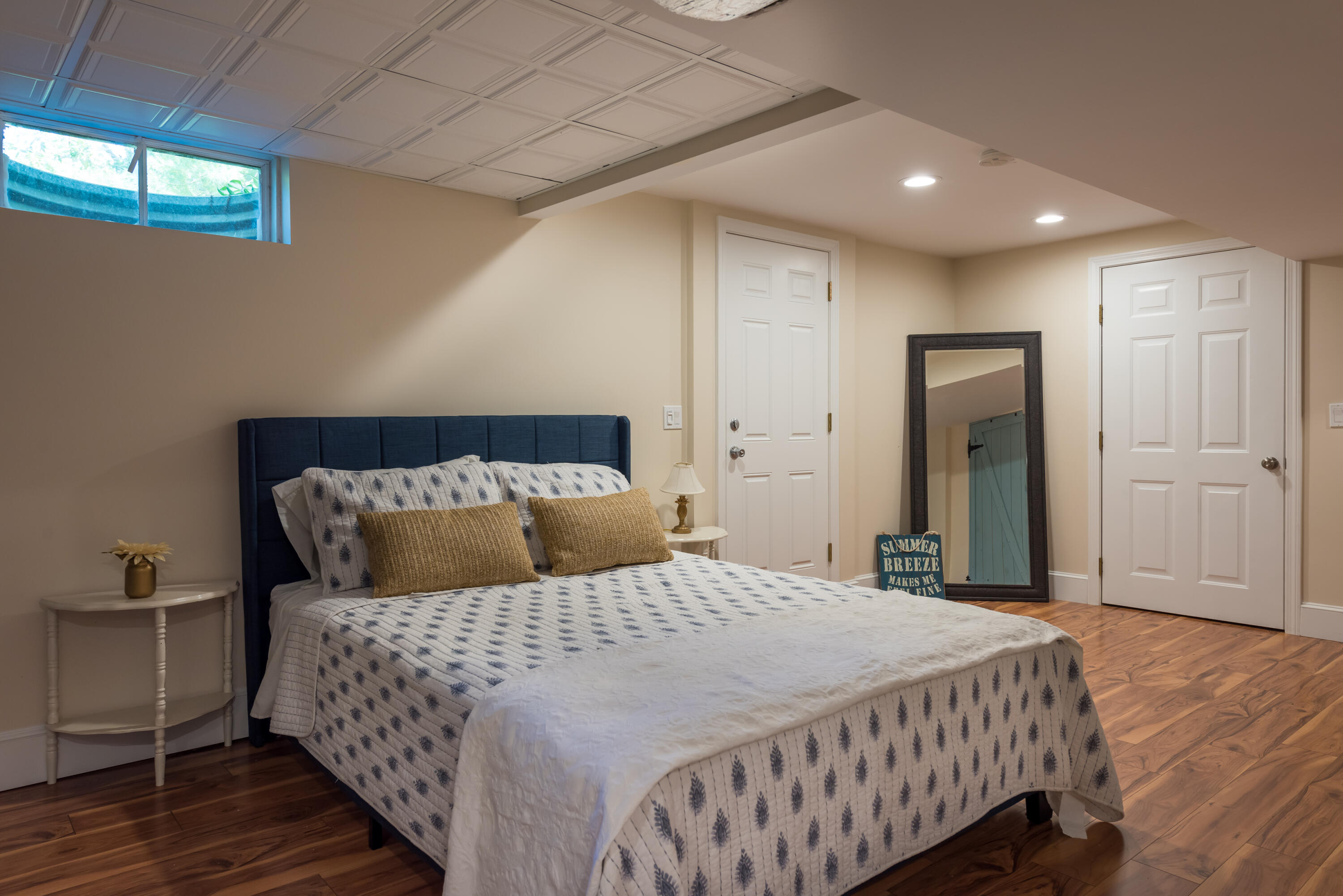 7 Sand Dollar Lane Mashpee, MA 02649 - Photo 25 of 33 a bedroom with a large bed and wooden floor
