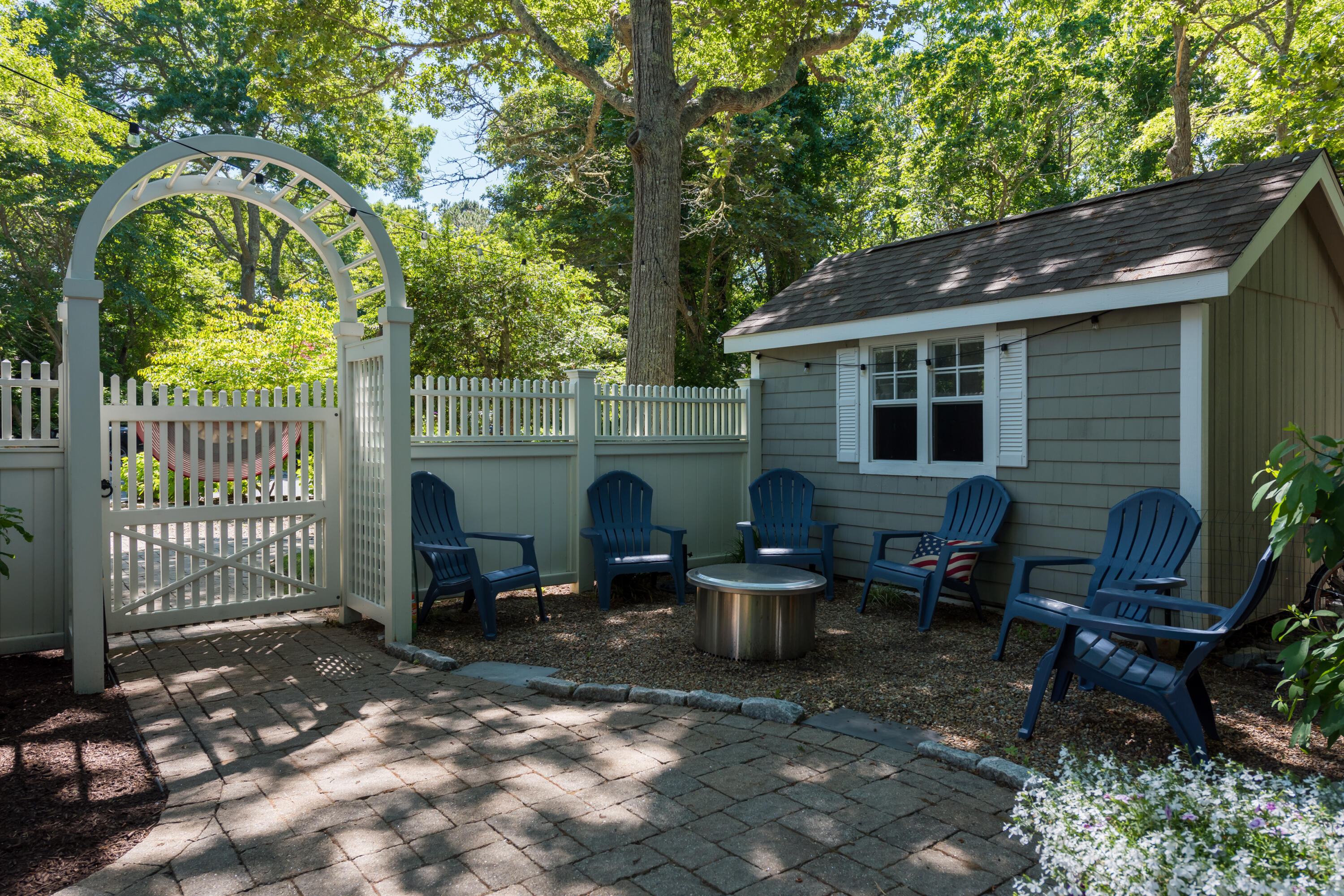 7 Sand Dollar Lane Mashpee, MA 02649 - Photo 29 of 33 a backyard of a house with seating space