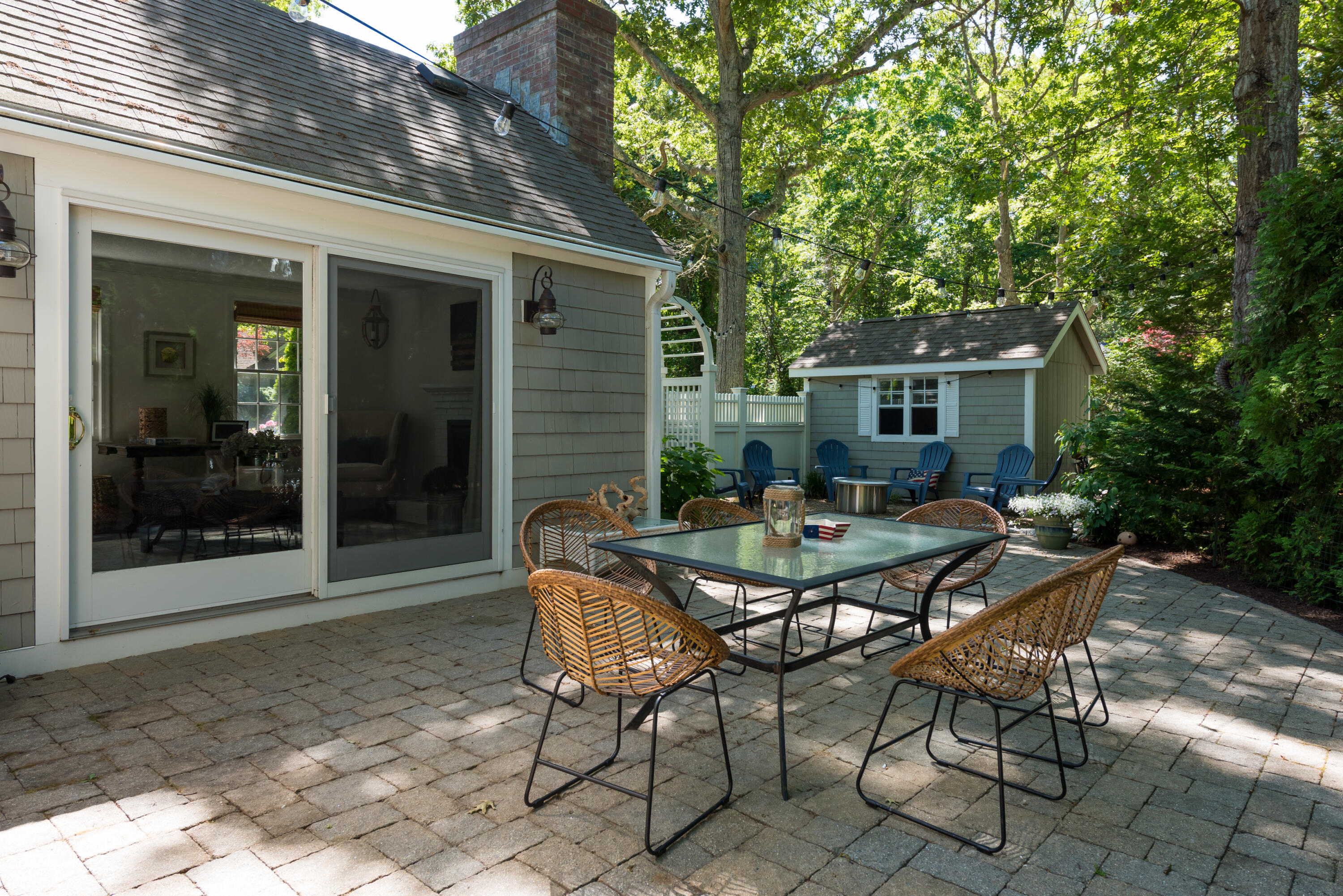 7 Sand Dollar Lane Mashpee, MA 02649 - Photo 30 of 33 a backyard of a house with table and chairs
