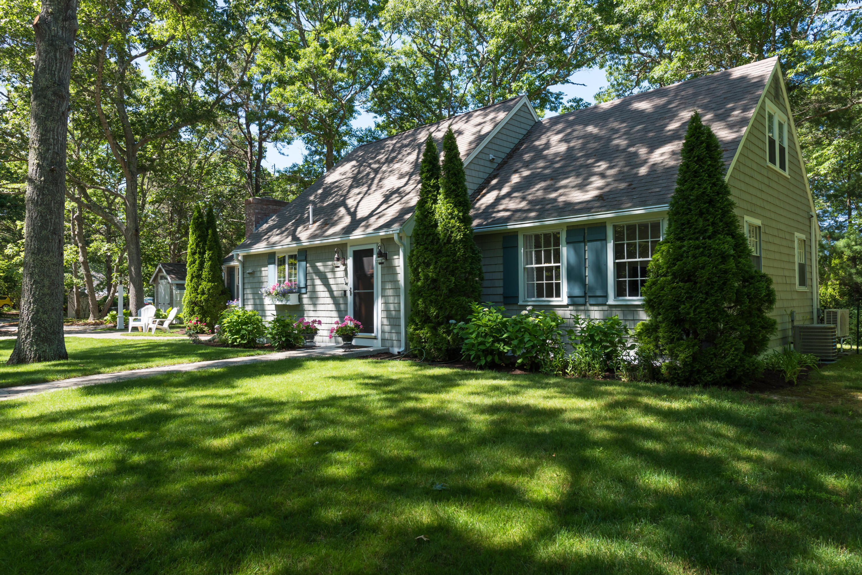 7 Sand Dollar Lane Mashpee, MA 02649 - Photo 4 of 33 a front view of a house with a yard