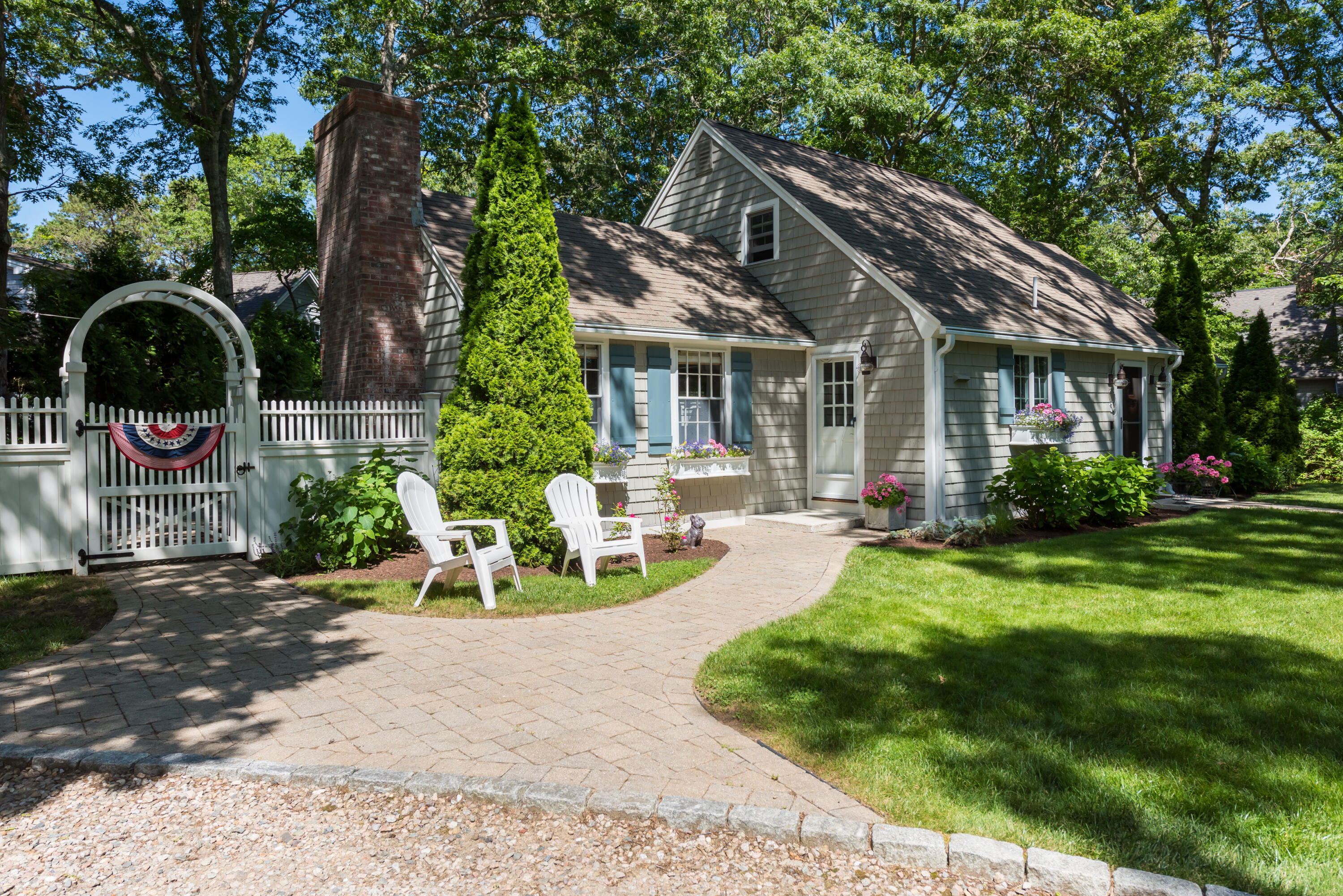 7 Sand Dollar Lane Mashpee, MA 02649 - Photo 5 of 33 a view of a house with backyard sitting area and garden