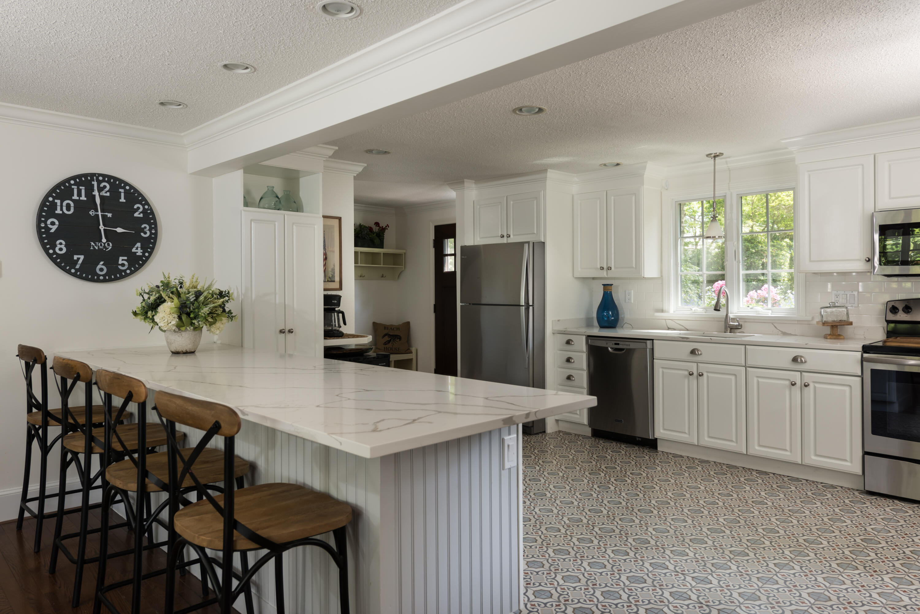 7 Sand Dollar Lane Mashpee, MA 02649 - Photo 9 of 33 a kitchen with refrigerator and chairs