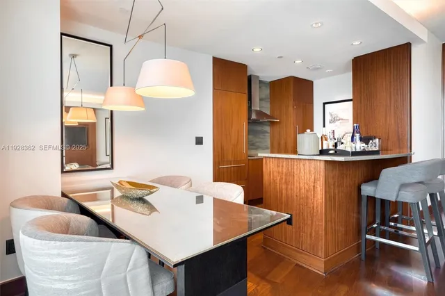 a kitchen with stainless steel appliances granite countertop a sink and cabinets
