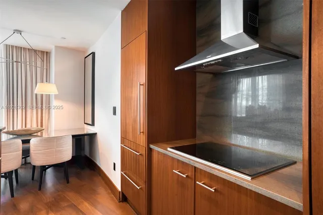 a view of a chairs and table in the balcony