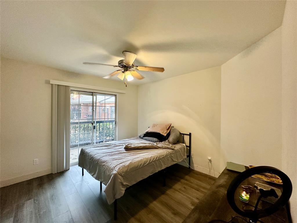 18333 Roehampton Drive, Unit 313 Dallas, TX 75252 - Photo 11 of 19 a bedroom with a bed and a window