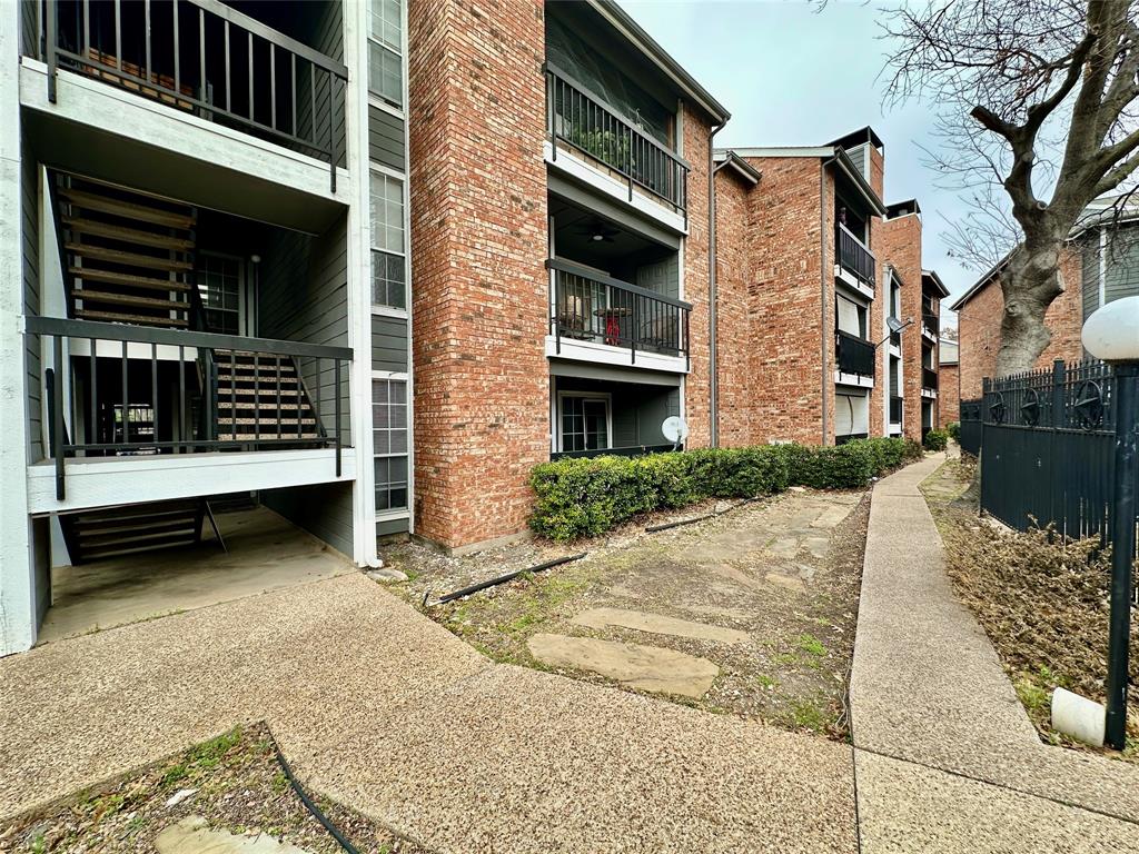 18333 Roehampton Drive, Unit 313 Dallas, TX 75252 - Photo 17 of 19 a view of a house with a yard