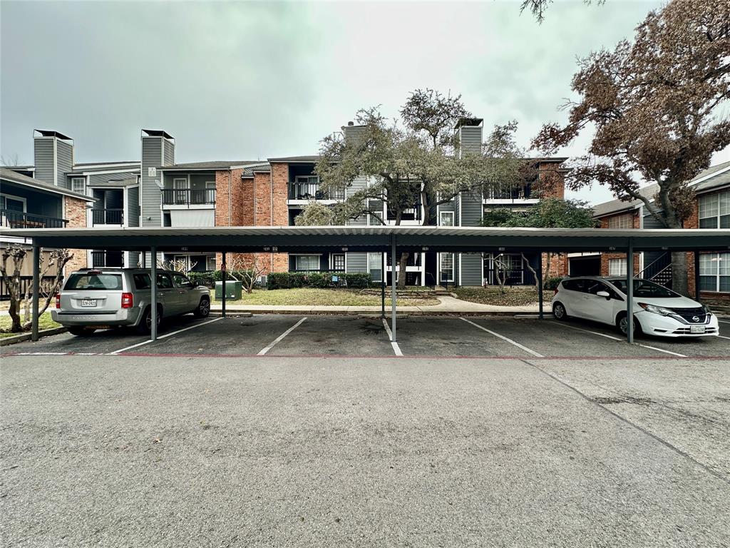 18333 Roehampton Drive, Unit 313 Dallas, TX 75252 - Photo 18 of 19 a view of street with parked cars