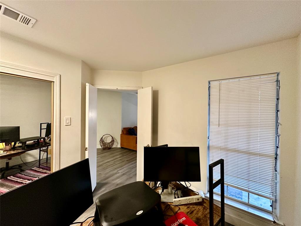 18333 Roehampton Drive, Unit 313 Dallas, TX 75252 - Photo 8 of 19 a living room with furniture and a flat screen tv