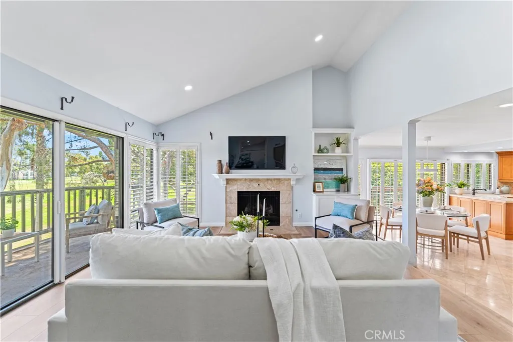 17 Verde, Unit 23 Irvine, CA 92612 - Photo 21 of 52 a living room with fireplace furniture and a large window