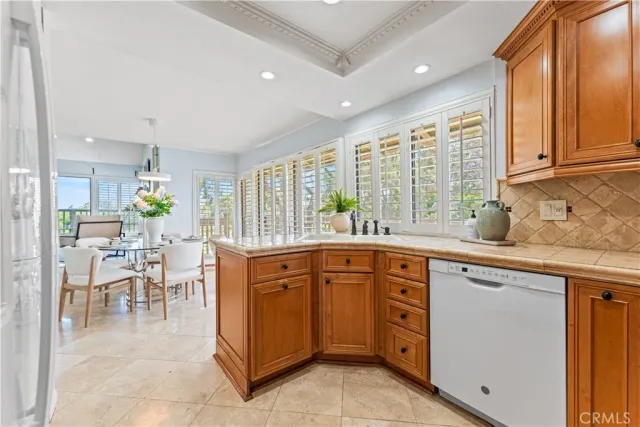a bed sitting in a bedroom next to a window with a balcony