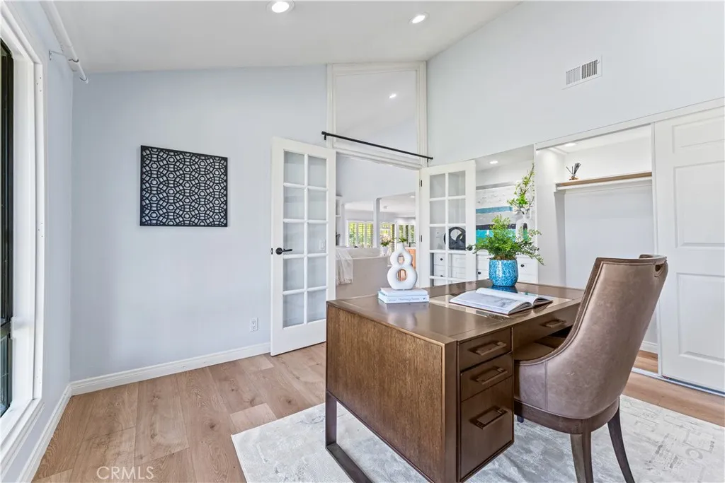 17 Verde, Unit 23 Irvine, CA 92612 - Photo 27 of 52 a view of kitchen with kitchen island stainless steel appliances sink refrigerator dining table and chairs