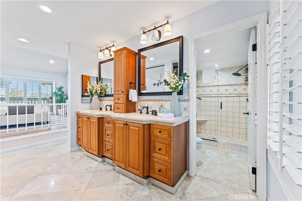 17 Verde, Unit 23 Irvine, CA 92612 - Photo 33 of 50 a bathroom with a double vanity sink mirror and double
