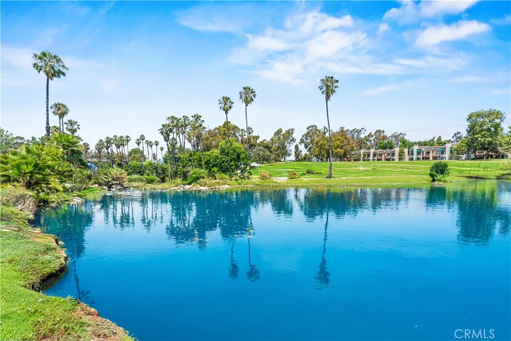 17 Verde, Unit 23 Irvine, CA 92612 - Photo 4 of 52 a view of a lake with a building in the background