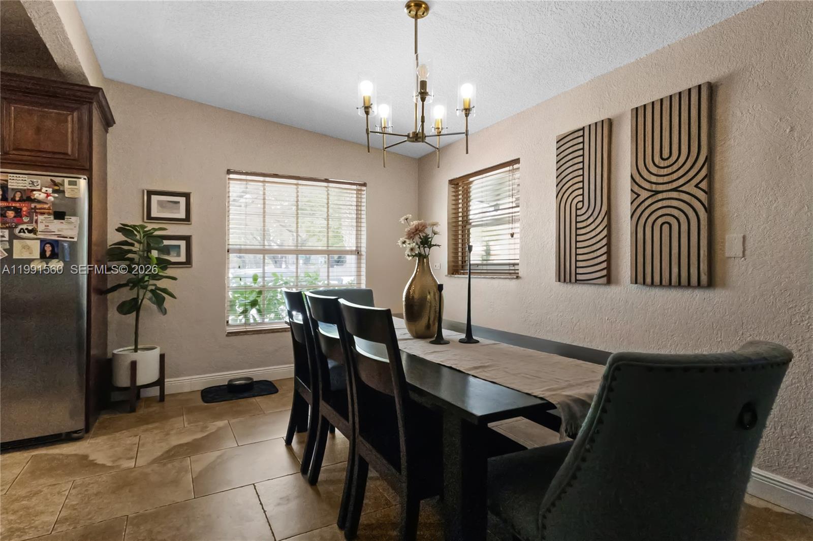 3500 Southwest 13th Street Miami, FL 33145 - Photo 16 of 51 a view of a dining room with furniture window and wooden floor