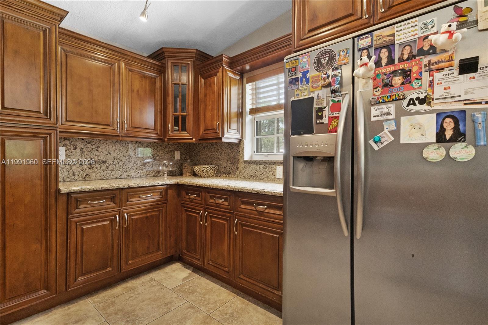 3500 Southwest 13th Street Miami, FL 33145 - Photo 18 of 51 a kitchen with stainless steel appliances granite countertop a sink and cabinets