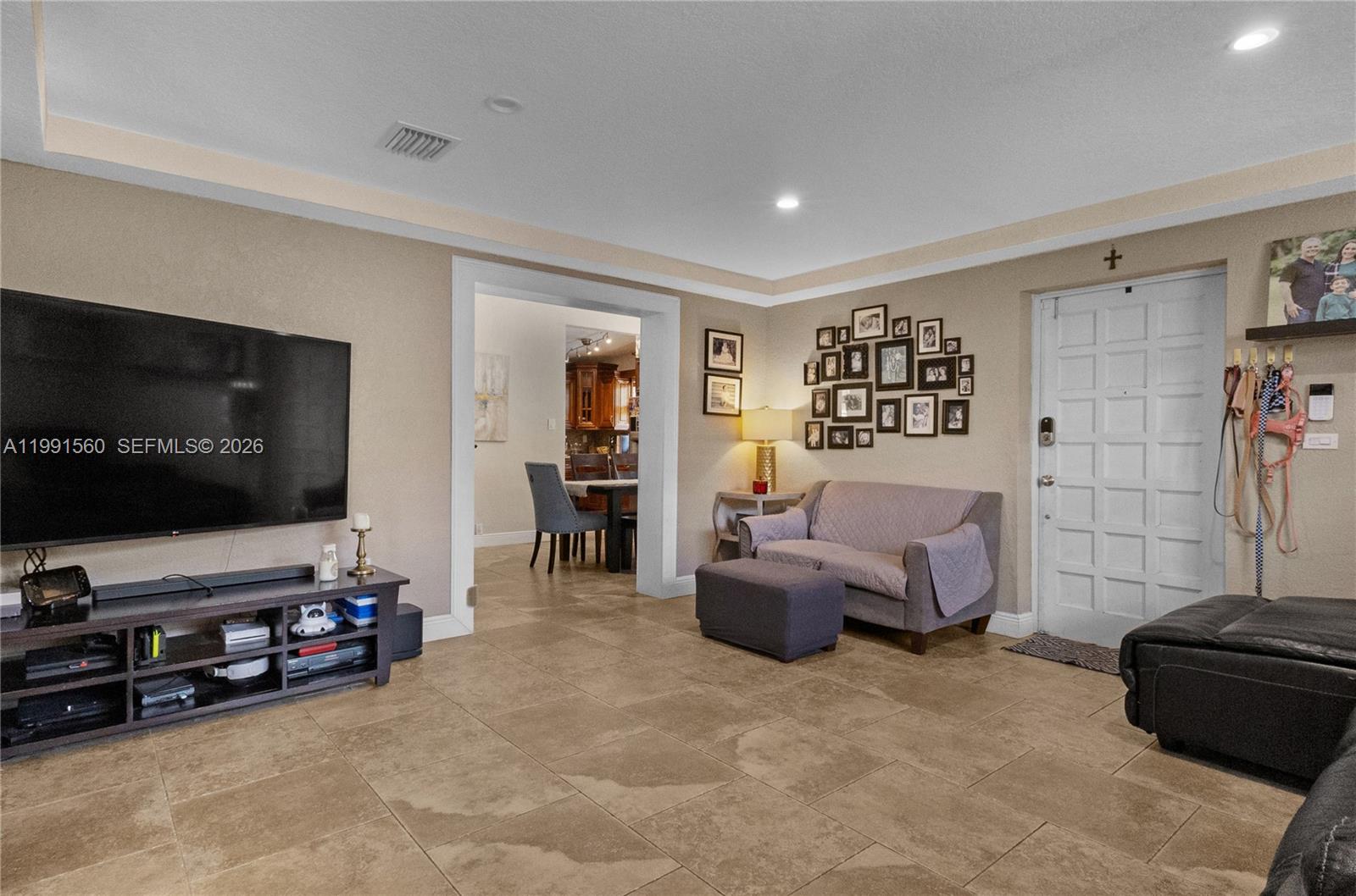 3500 Southwest 13th Street Miami, FL 33145 - Photo 2 of 51 a living room with furniture and a flat screen tv