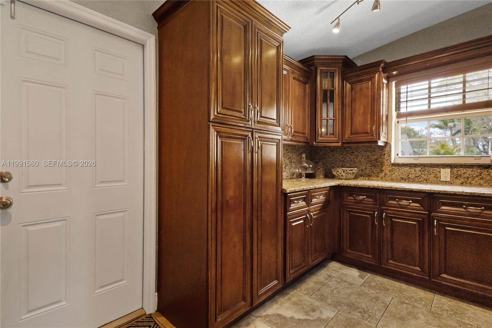3500 Southwest 13th Street Miami, FL 33145 - Photo 21 of 51 a kitchen with stainless steel appliances granite countertop a refrigerator and a sink