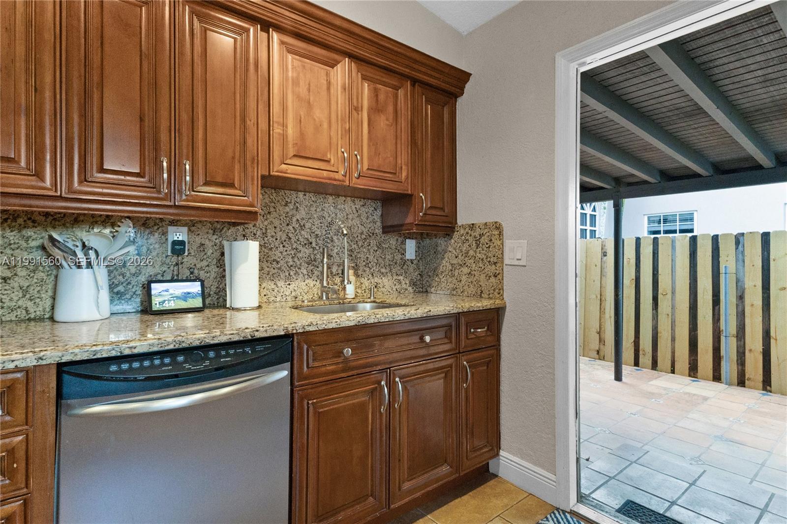 3500 Southwest 13th Street Miami, FL 33145 - Photo 23 of 51 a kitchen with granite countertop stainless steel appliances a sink and cabinets