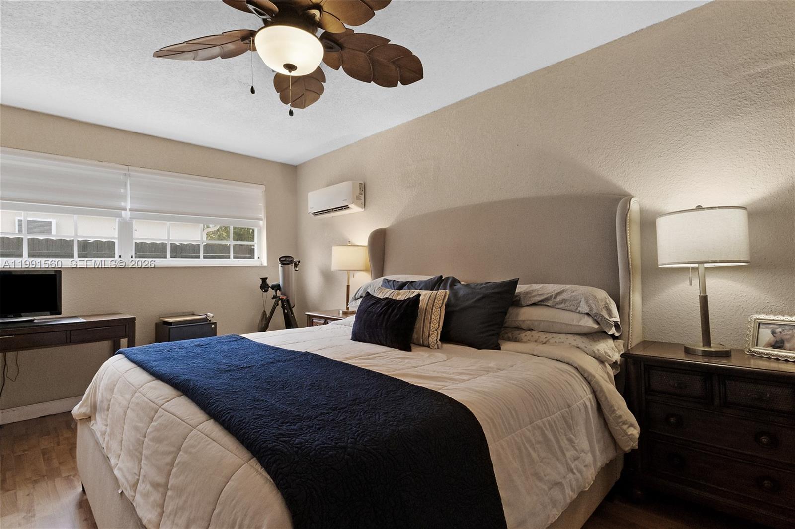 3500 Southwest 13th Street Miami, FL 33145 - Photo 24 of 51 a bedroom with a bed and wooden floor