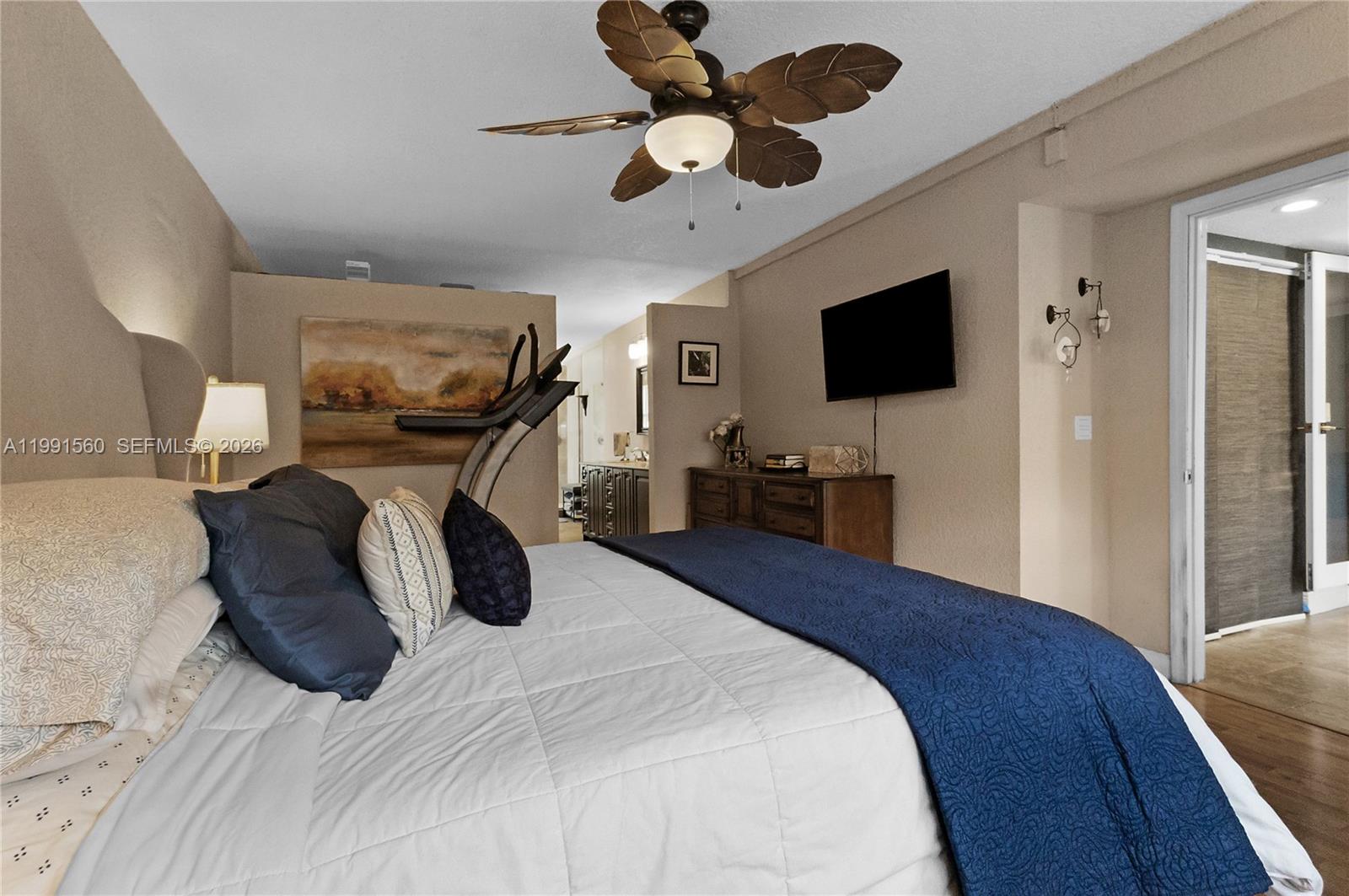 3500 Southwest 13th Street Miami, FL 33145 - Photo 25 of 51 a bedroom with a bed and a flat screen tv