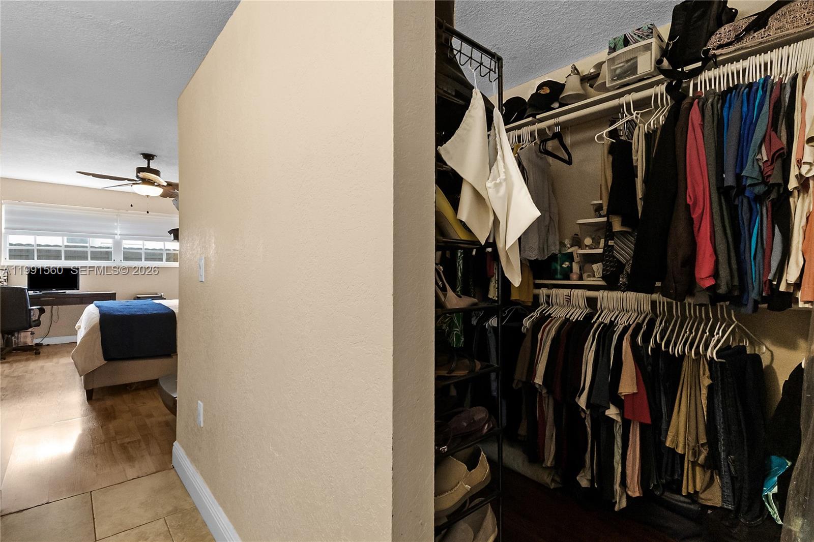 3500 Southwest 13th Street Miami, FL 33145 - Photo 27 of 51 a view of walk in closet with clothes and shoes