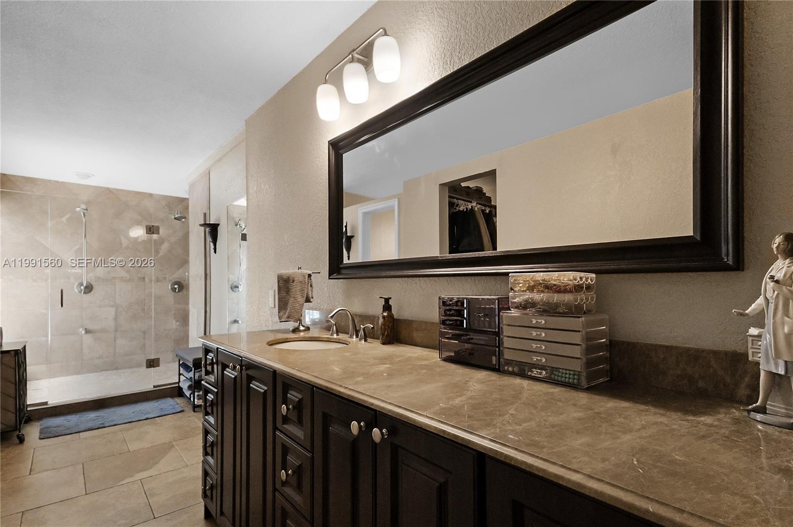 3500 Southwest 13th Street Miami, FL 33145 - Photo 29 of 51 a bathroom with a sink and a mirror