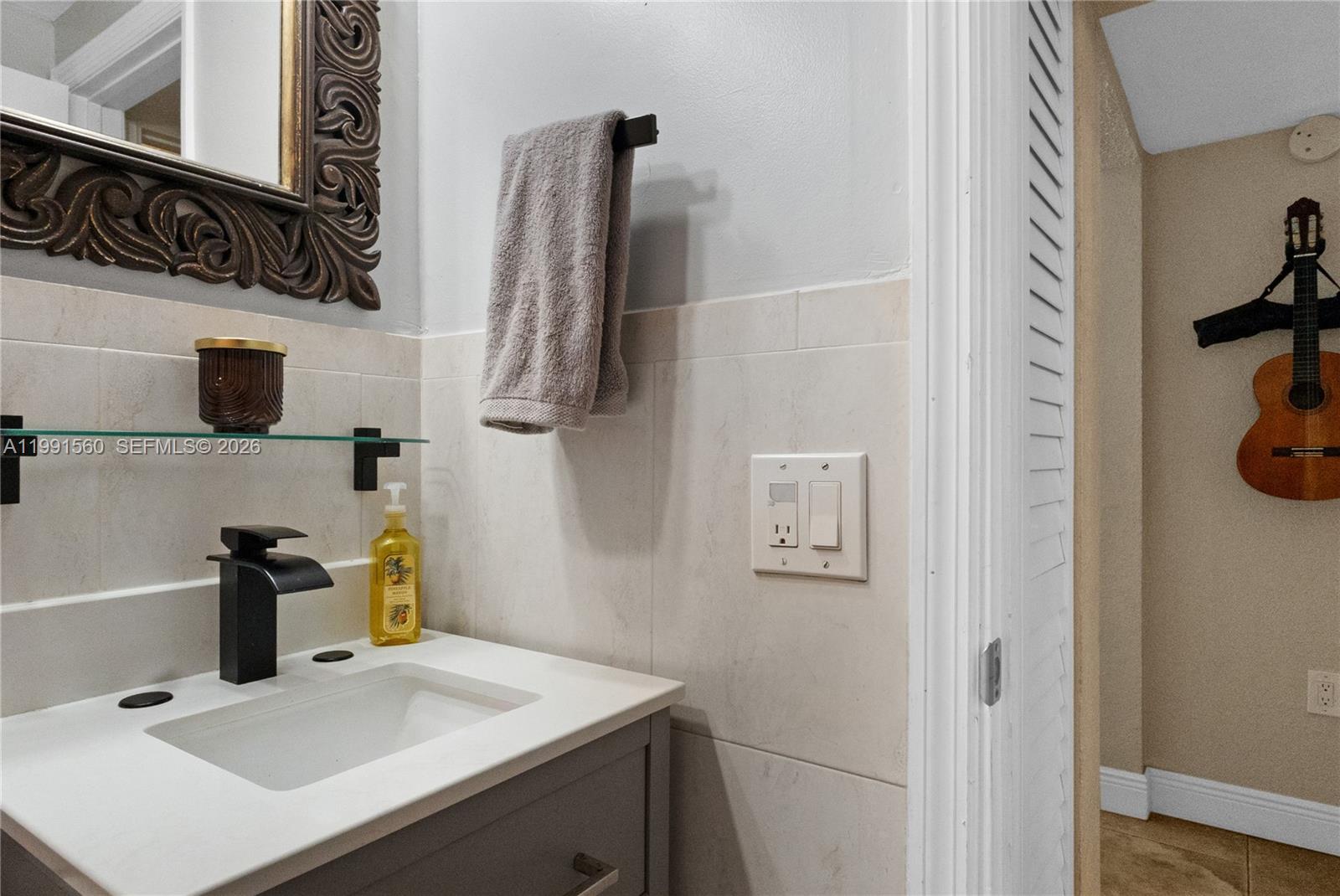 3500 Southwest 13th Street Miami, FL 33145 - Photo 40 of 51 a bathroom with a sink and a mirror