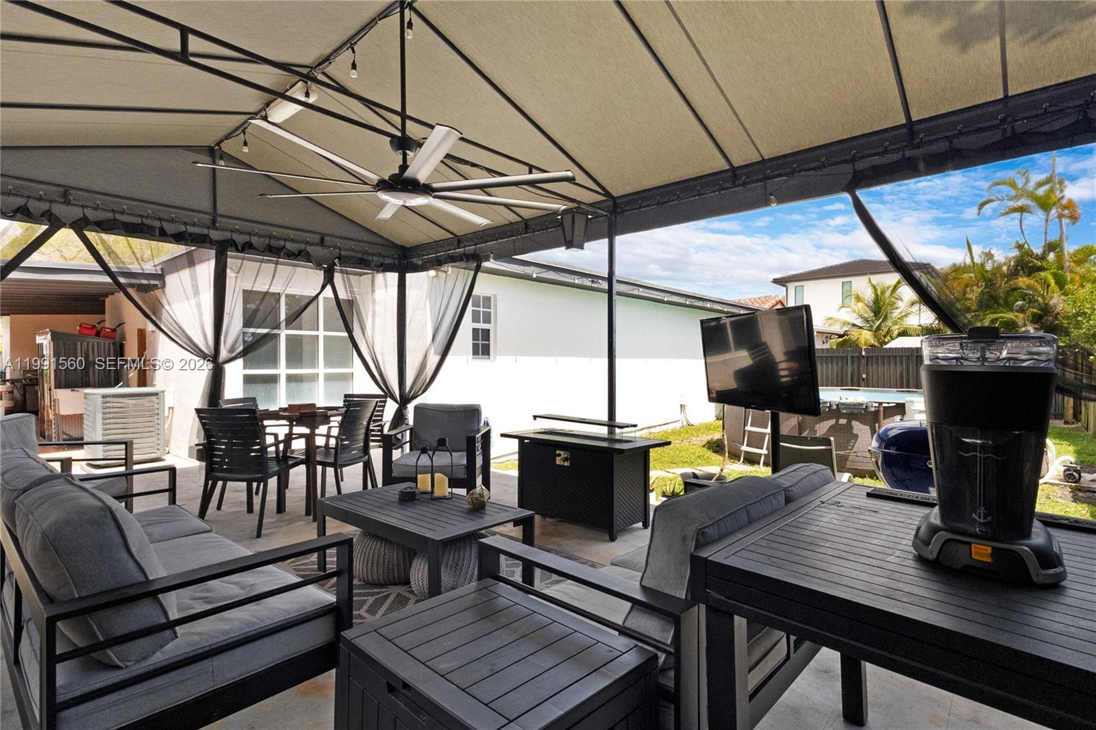 3500 Southwest 13th Street Miami, FL 33145 - Photo 46 of 51 a living room with fireplace furniture and a flat screen tv