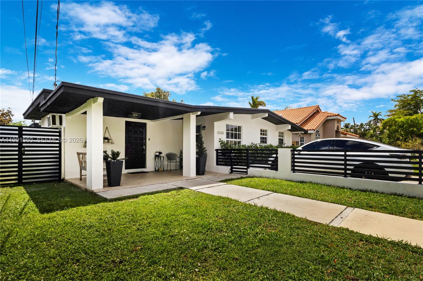 3500 Southwest 13th Street Miami, FL 33145 - Photo 5 of 51 a view of a house with backyard and porch