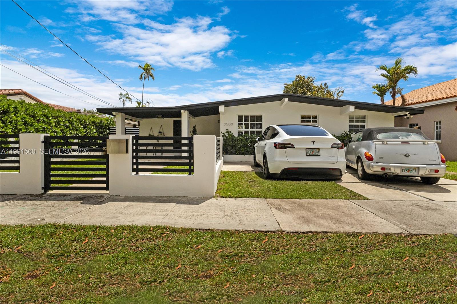 3500 Southwest 13th Street Miami, FL 33145 - Photo 7 of 51 a front view of a house with a garden