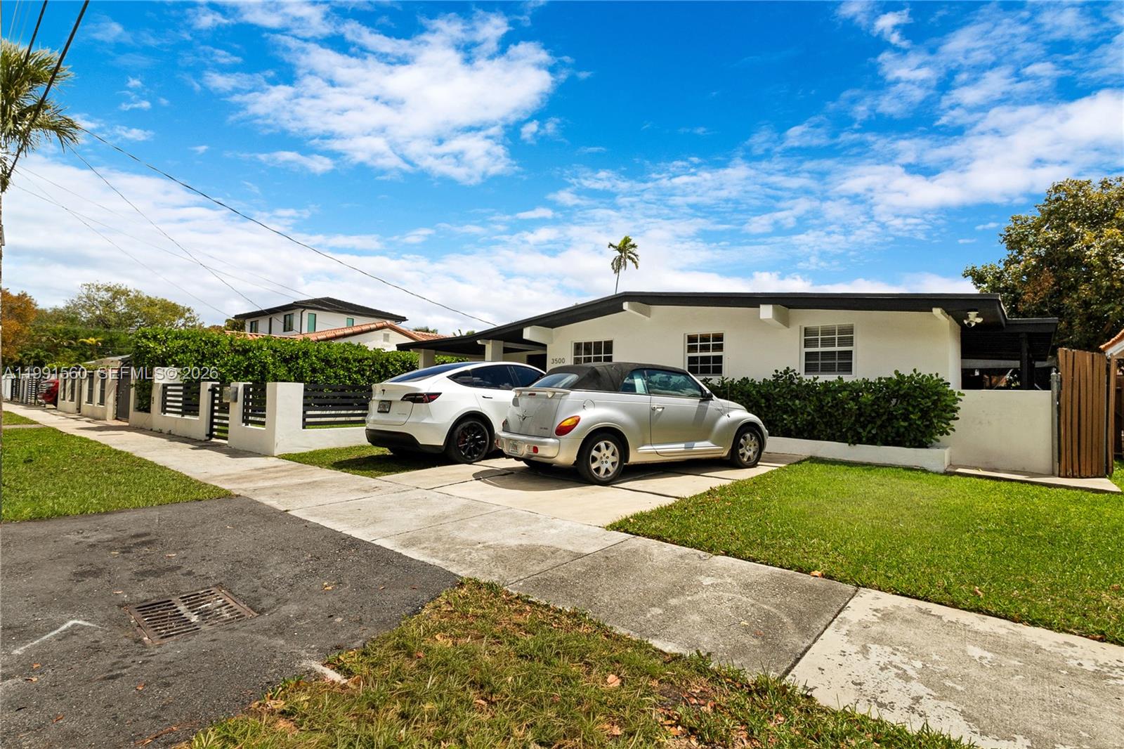 3500 Southwest 13th Street Miami, FL 33145 - Photo 8 of 51 a view of a car parked in front of a house